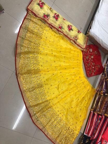 yellow net with sequence embroidered lehenga
