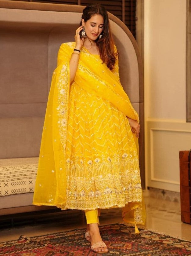 Yellow organza emboroidered anarkali suit for ceremony