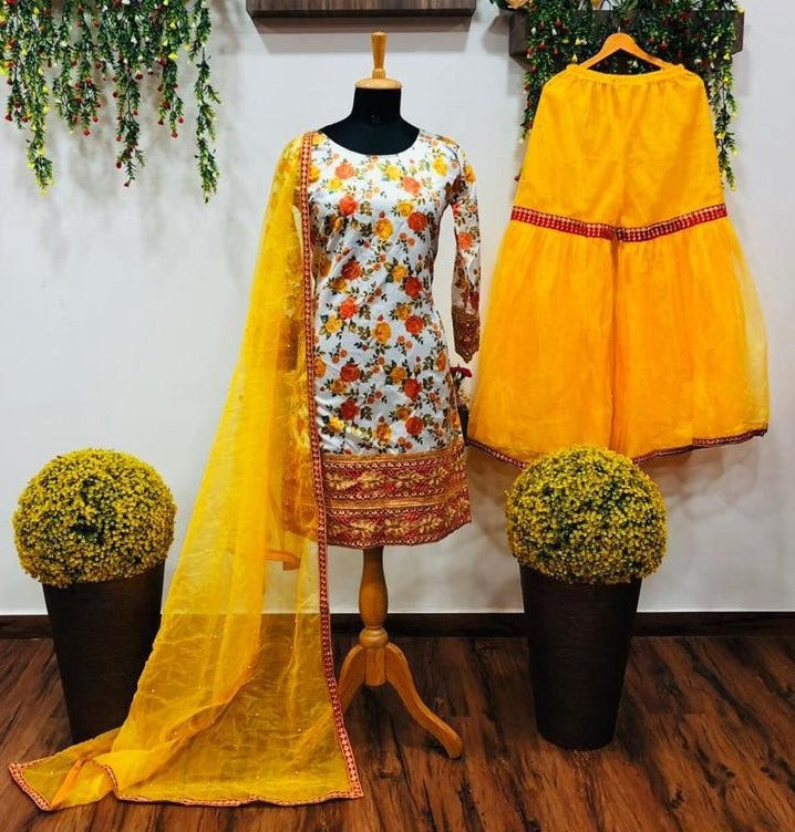 Yellow print and embroidered sharara suit for haldi ceremony