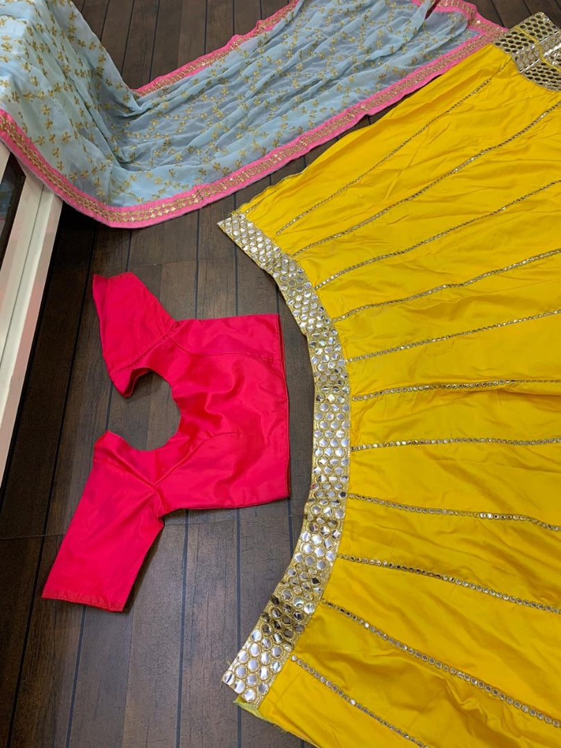 Yellow tapeta silk foil mirror work lehenga choli for ceremony