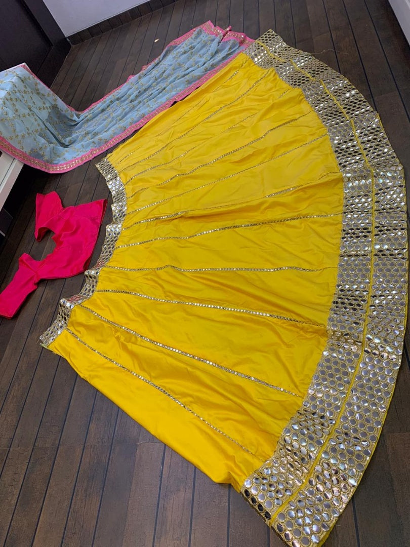 Yellow tapeta silk foil mirror work lehenga choli for ceremony