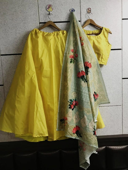 yellow tapeta silk plain party festival wear lehenga with printed dupatta
