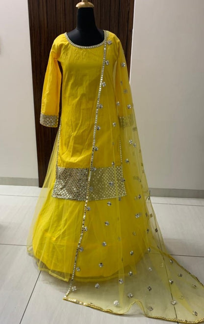 Yellow tapeta silk with foil mirror work suit lehenga