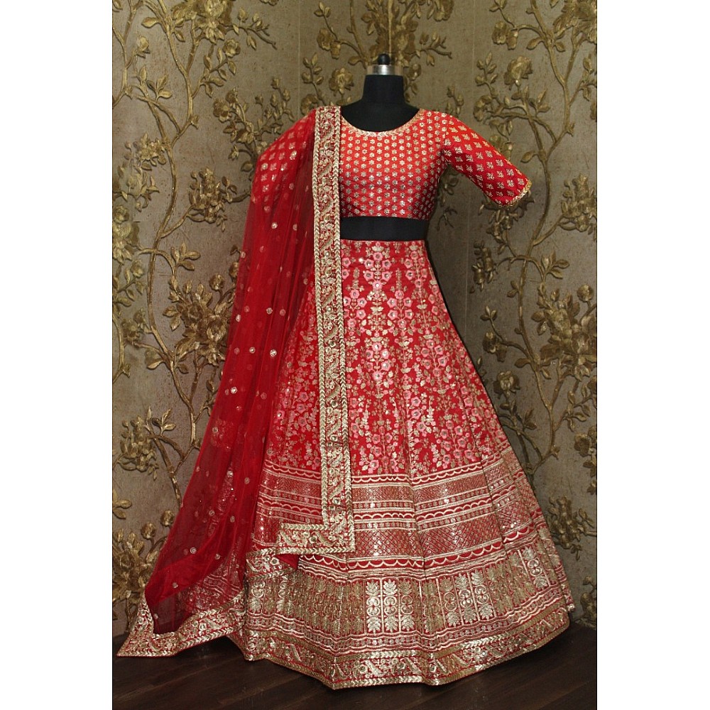 Pink floral embroidery on red base art silk bridal lehenga