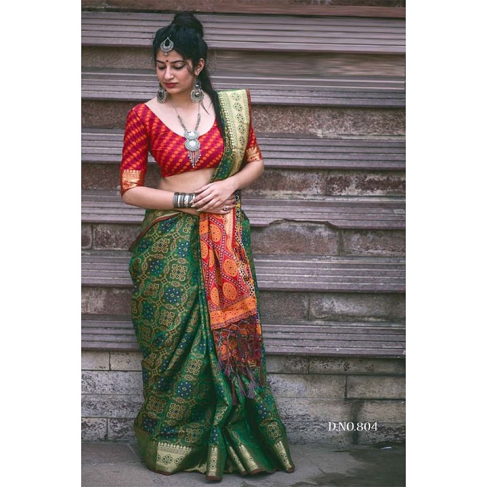 Green patola silk saree with contrast blouse