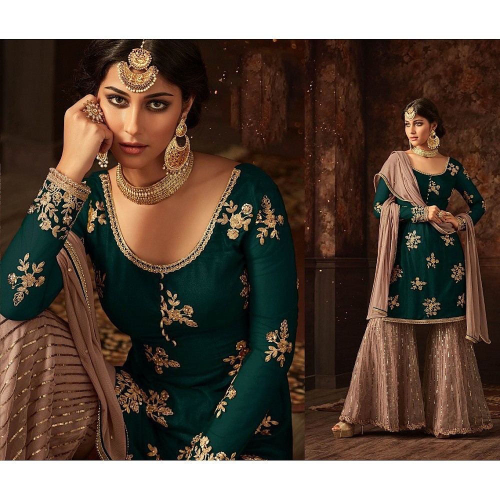 Green heavy embroidered and stone work sharara salwar suit