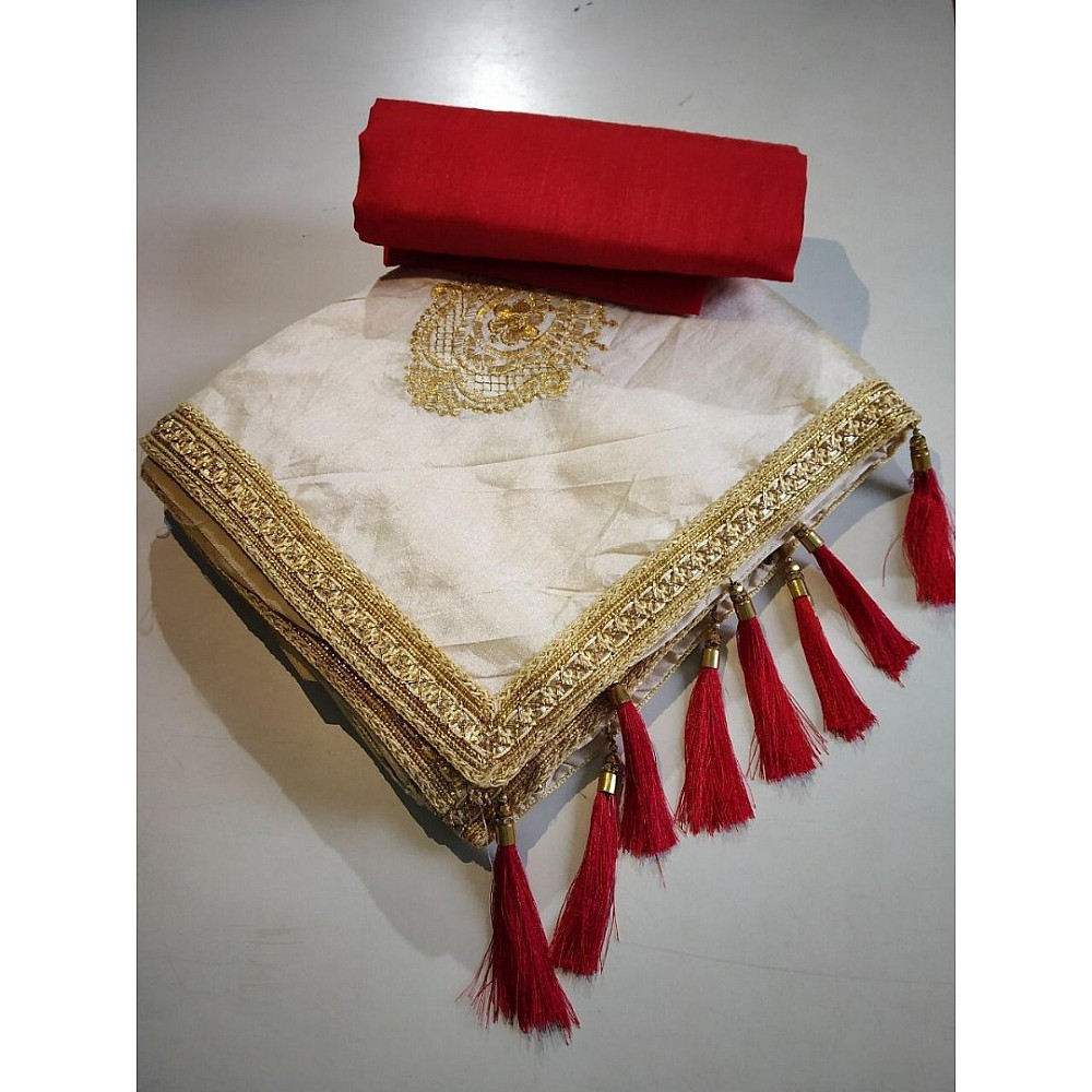 Cream zarna silk saree with red tassels