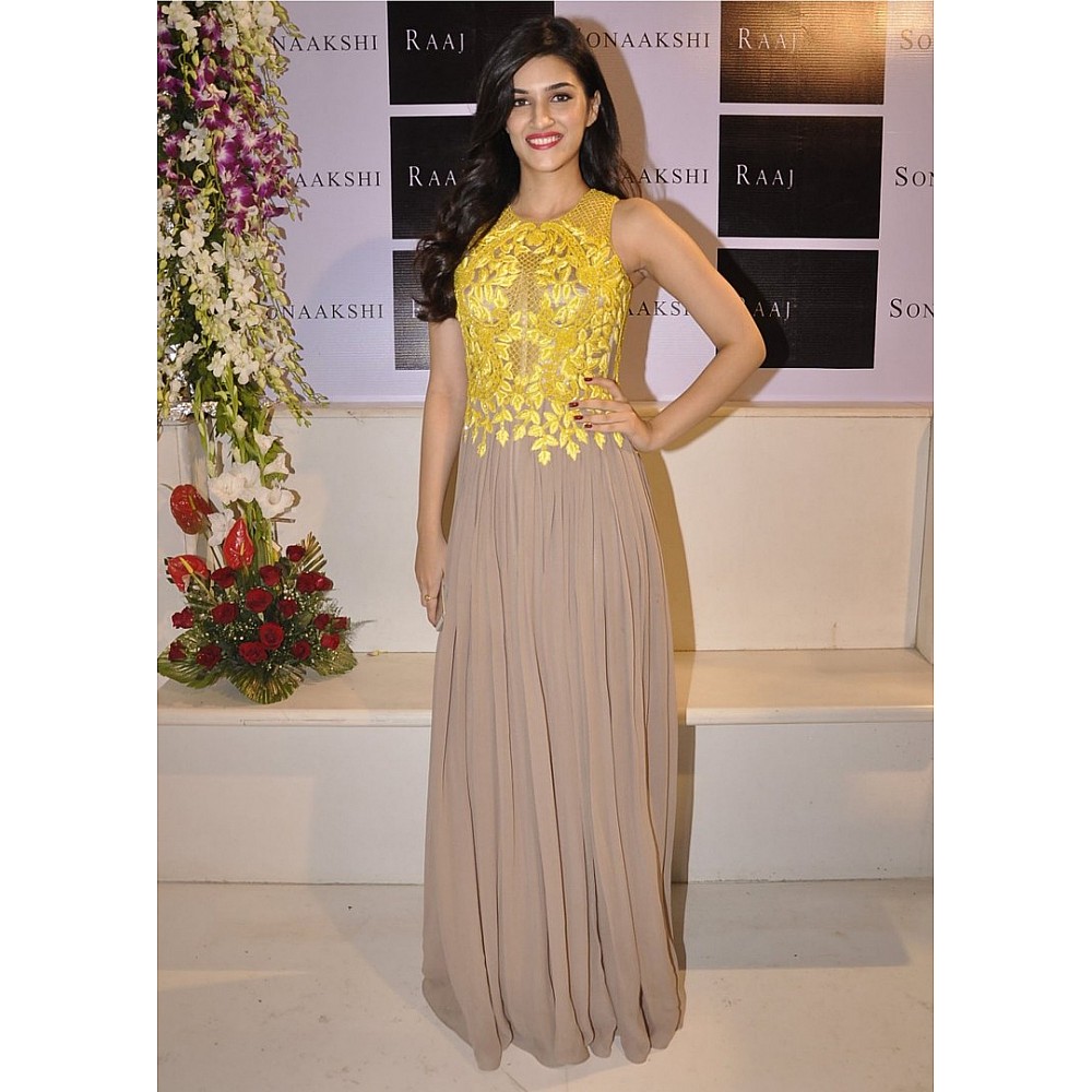 stylist bollywood style yellow and brown kriti sanon partywear gown