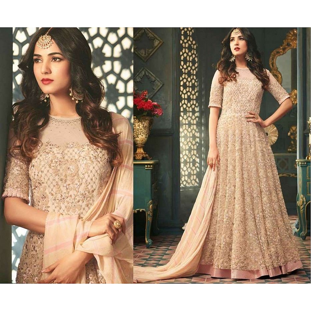 Cream Colored Net Heavy Embroidered Semi Stitched anarkali Suit