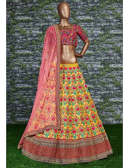 Yellow mulbury silk heavy embroidered bridal lehenga for haldi function
