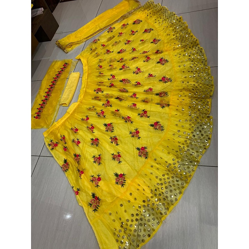 Yellow net embroidered lehenga choli