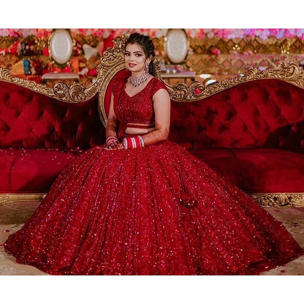 Red heavy embroidered sequence worked wedding lehenga choli