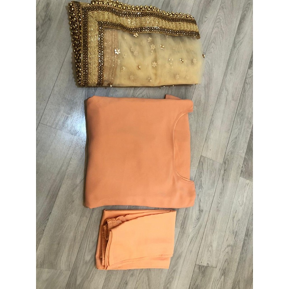 Light orange salwar suit with heavy dupatta