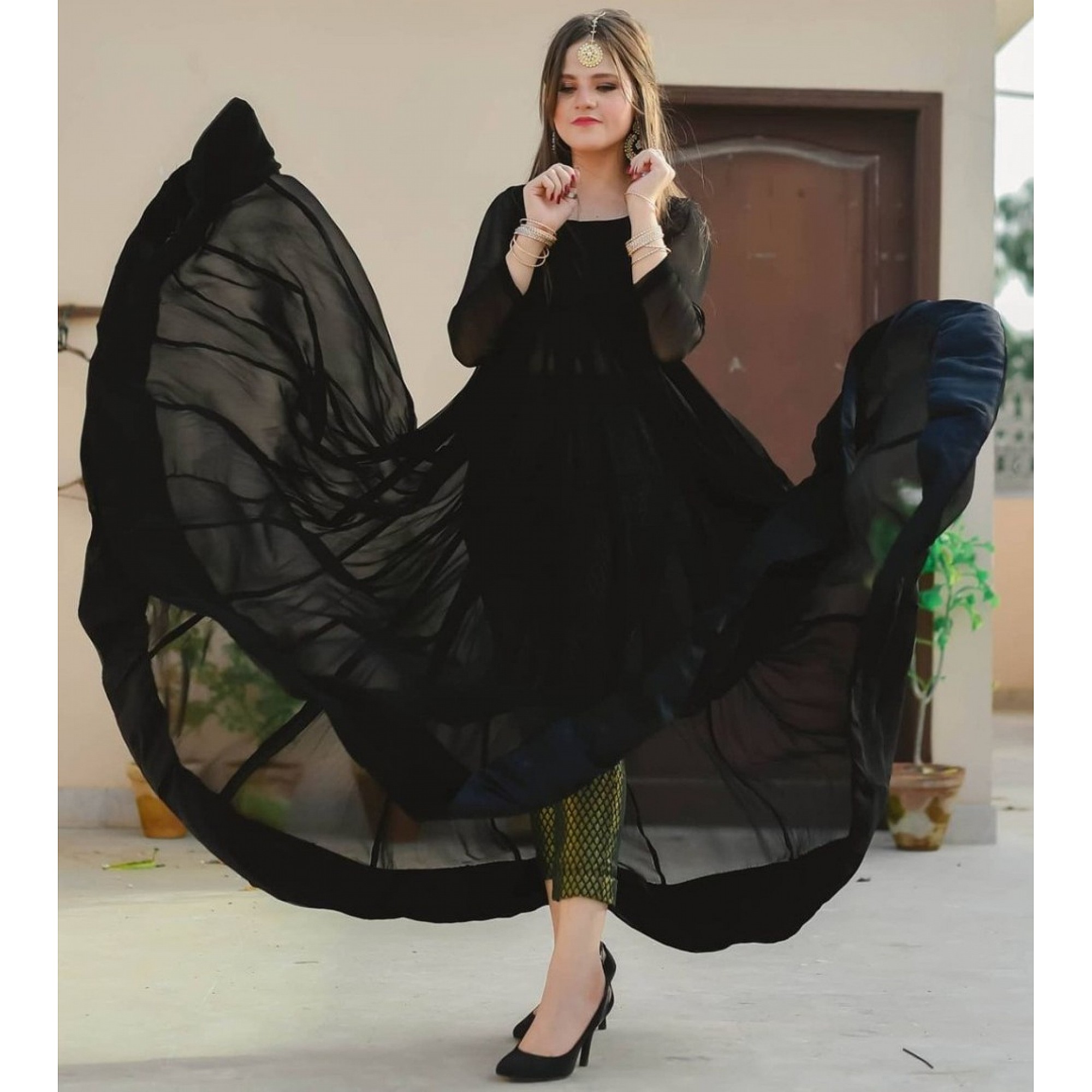 Gown : Black georgette gown with banarasi bottom