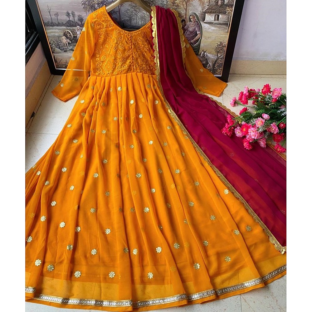 Mustard yellow heavy georgette embroidered party wear gown