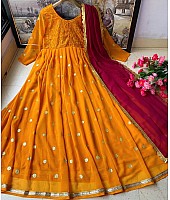 Mustard yellow heavy georgette embroidered party wear gown