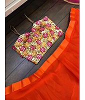 Orange ceremonial lehenga choli with heavy work blouse