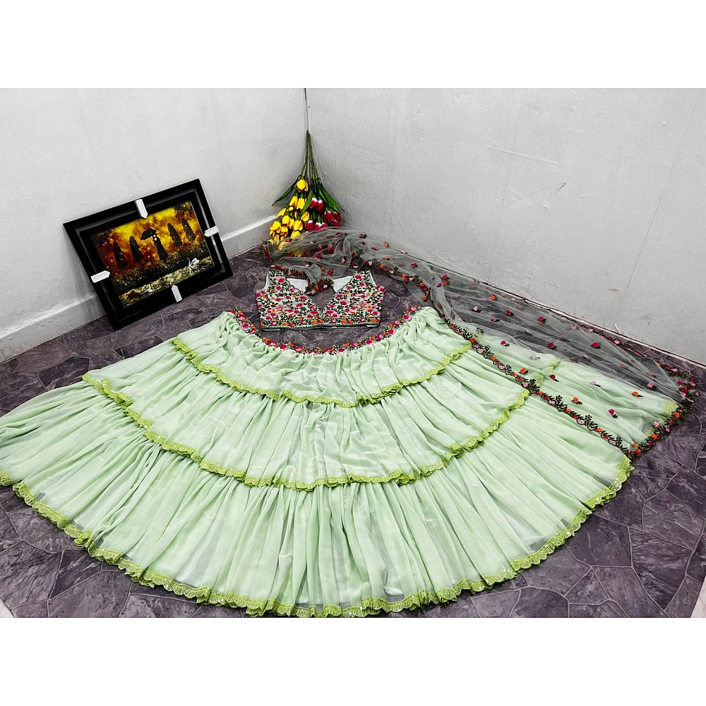 Pista green faux georgette ruffle lehenga with embroidered choli