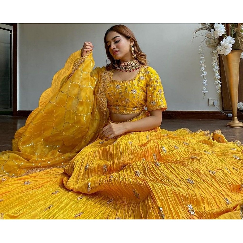 Yellow chinon silk embroidered pleated lehenga for haldi ceremony