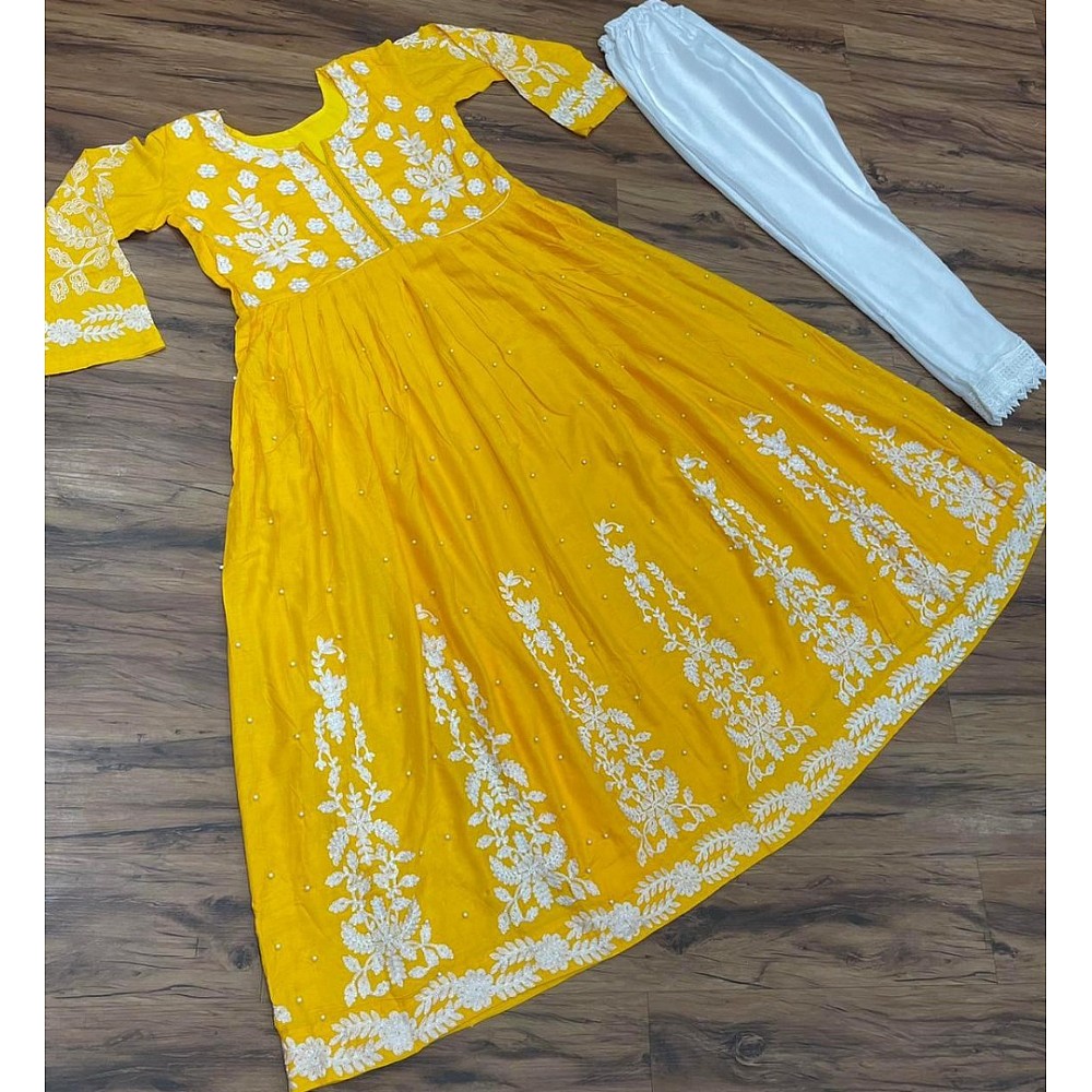 Yellow muslin cotton embroidered with moti work plazzo suit