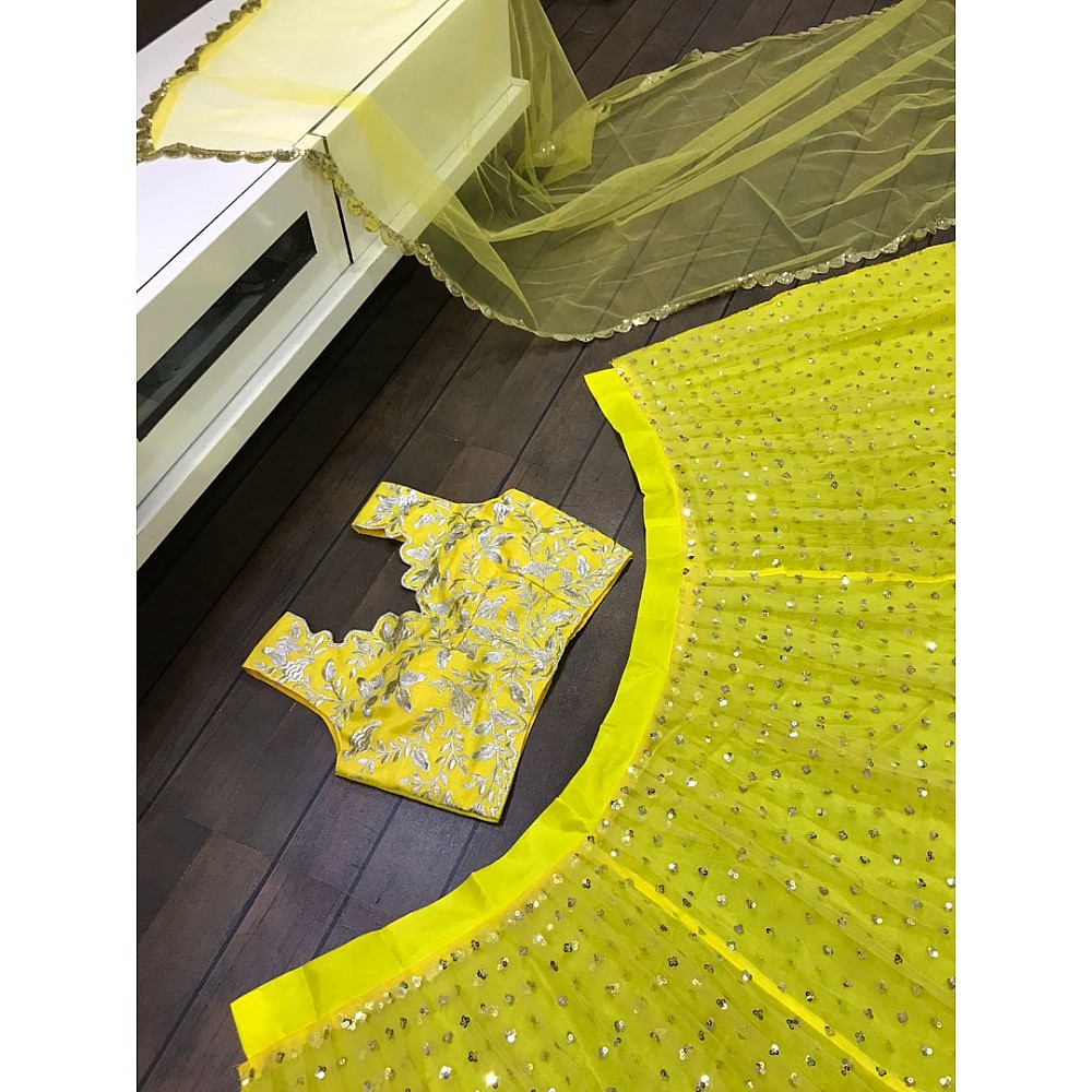 Yellow net sequence and thread embroidered ceremonial lehenga choli