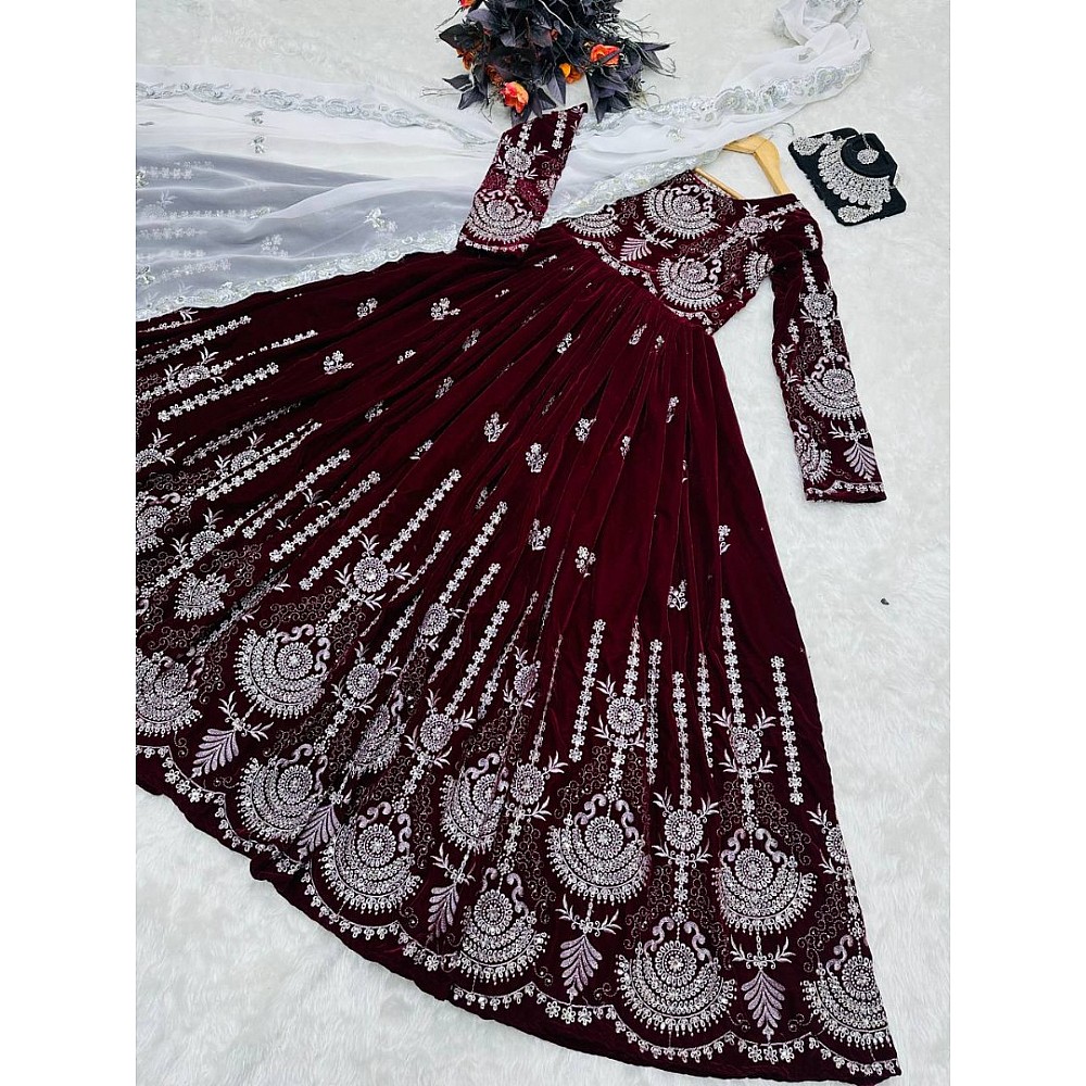 Gown : Maroon velvet heavy embroidery worked wedding gown