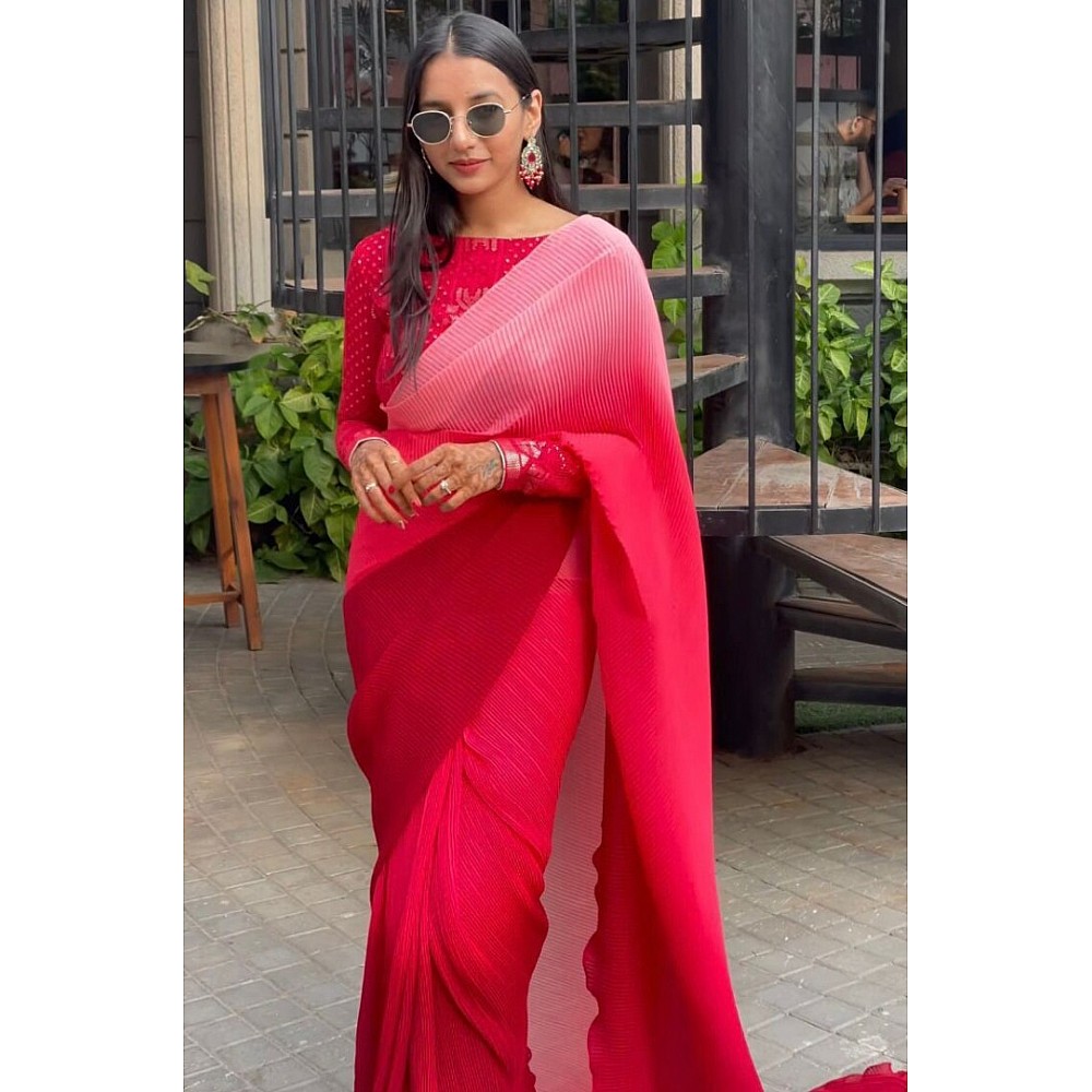 Multi shade red georgette pleated saree with heavy blouse