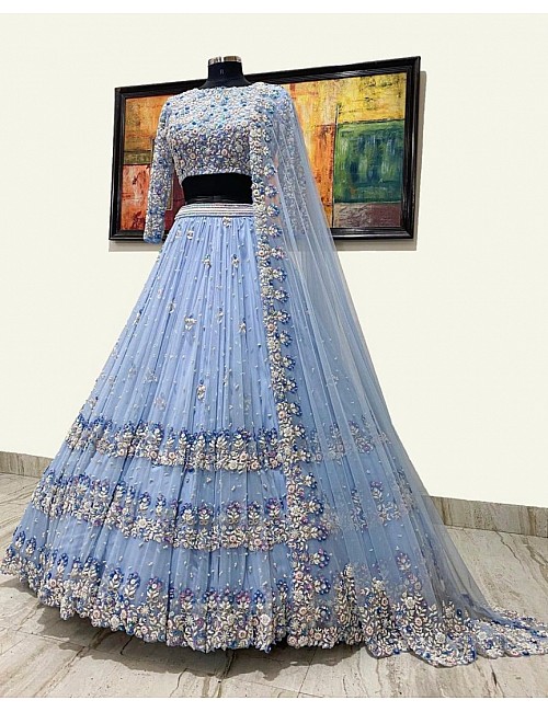 Sky blue net heavy embroidered ceremonial lehenga choli