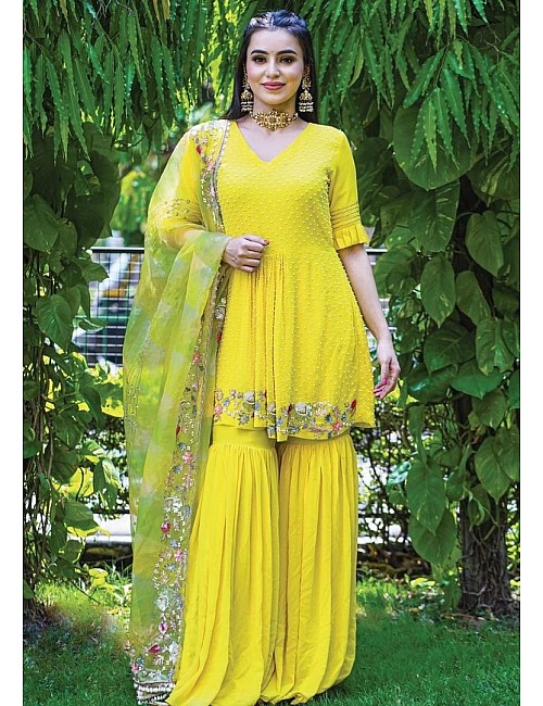 Yellow georgette embroidered and moti work sharara suit