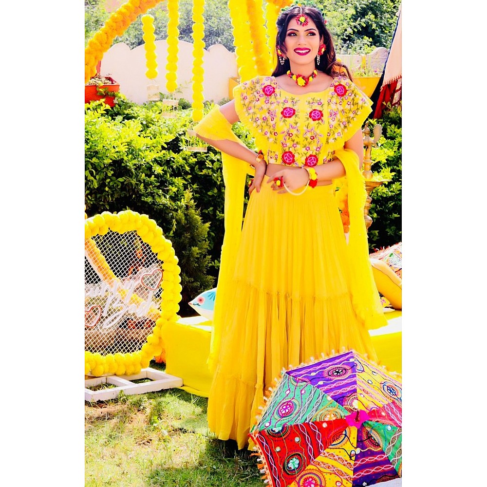 Yellow georgette embroidered ruffle lehenga for haldi ceremony