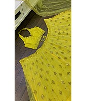 Yellow net embroidery work lehenga choli for haldi ceremony
