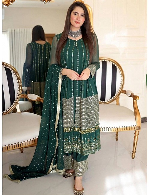 Green heavy embroidery worked salwar suit with shrug