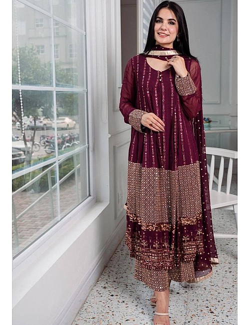 Wine heavy embroidery worked salwar suit with shrug